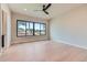 Bright bedroom with natural light, hardwood floors, and a ceiling fan at 5820 Powell Rd, Parker, CO 80134