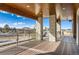 Large deck with a wooden ceiling and mountain views at 5820 Powell Rd, Parker, CO 80134
