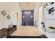 Spacious entryway with hardwood floors, a modern chandelier, and staircase at 5820 Powell Rd, Parker, CO 80134