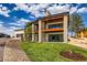 A well-maintained lawn complements the modern design with stone and wood accents of the exterior elevation at 5820 Powell Rd, Parker, CO 80134