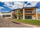 Beautiful exterior featuring stone accents, a covered balcony, and a spacious driveway with ample parking at 5820 Powell Rd, Parker, CO 80134