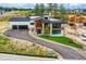 Attractive home boasting stone accents, a two-car garage, and a meticulously maintained lawn at 5820 Powell Rd, Parker, CO 80134