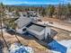 Angled view of the house showcasing its modern design and attached two-car garage at 5820 Powell Rd, Parker, CO 80134
