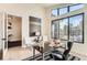 Spacious home office with built-in shelves and large windows offering natural light at 5820 Powell Rd, Parker, CO 80134