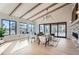 Elegant living room boasts hardwood floors, large windows, and a cozy seating area at 5820 Powell Rd, Parker, CO 80134