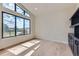 Bright living room featuring hardwood floors, large windows, and custom built-in shelving at 5820 Powell Rd, Parker, CO 80134