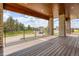 Covered patio with stone columns and wood ceiling offers a beautiful view at 5820 Powell Rd, Parker, CO 80134