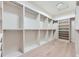 Large walk-in closet with custom shelves and ample storage space at 5820 Powell Rd, Parker, CO 80134