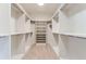 Spacious walk-in closet with ample shelving and hanging space at 5820 Powell Rd, Parker, CO 80134