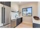 Convenient wet bar with sink, dishwasher, and ample counter space at 5820 Powell Rd, Parker, CO 80134
