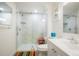 Bright bathroom featuring a marble tiled walk-in shower and updated fixtures at 4994 S Independence Way, Littleton, CO 80123
