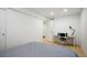 Bedroom with neutral walls, wood floors, a bright window, desk and chair at 4994 S Independence Way, Littleton, CO 80123