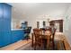 Dining room with natural light adjacent to office nook and open to modern kitchen at 4994 S Independence Way, Littleton, CO 80123