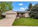 Charming single-story home with a well-manicured lawn and attached two-car garage at 4994 S Independence Way, Littleton, CO 80123