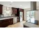 Modern kitchen with stainless steel appliances, sleek cabinets, and granite countertops at 4994 S Independence Way, Littleton, CO 80123