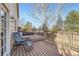 Inviting back deck perfect for outdoor relaxation, featuring a chair and views of the backyard at 17076 Foxton Dr, Parker, CO 80134