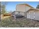 Expansive backyard with a well-maintained deck, hot tub, and convenient storage shed at 17076 Foxton Dr, Parker, CO 80134
