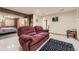 Finished basement area with TV, sofa, rug, and view to bedroom at 17076 Foxton Dr, Parker, CO 80134