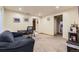 Basement den area with sofa, work space, and views to other rooms at 17076 Foxton Dr, Parker, CO 80134