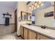 Bathroom featuring a double vanity, ample lighting, framed mirrors, and ceramic tile flooring at 17076 Foxton Dr, Parker, CO 80134