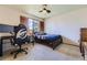 Bedroom featuring window, ceiling fan, and space for both sleeping and working at 17076 Foxton Dr, Parker, CO 80134