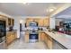 Well-lit kitchen featuring stainless steel appliances, light wood cabinets, and ample counter space at 17076 Foxton Dr, Parker, CO 80134