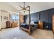 Comfortable primary bedroom with stylish decor, a cozy bed, and natural light at 17076 Foxton Dr, Parker, CO 80134