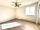 Comfortable bedroom with a ceiling fan and a large window at 755 S Alton Way # 12C, Denver, CO 80247