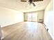 Spacious living room with natural light and access to the balcony at 755 S Alton Way # 12C, Denver, CO 80247