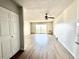 Open-concept living room with sliding glass doors and modern flooring at 755 S Alton Way # 12C, Denver, CO 80247