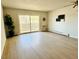 Spacious living room featuring new flooring, sliding glass doors, and ample natural light at 755 S Alton Way # 12C, Denver, CO 80247