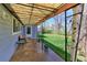 Cozy covered patio with comfortable seating overlooking a well-maintained backyard and lush green lawn at 2561 S Carey Way, Denver, CO 80222