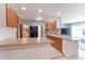Spacious kitchen with ample counter space, stainless steel appliances, and views into the living room at 2561 S Carey Way, Denver, CO 80222