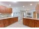 Open-concept kitchen with breakfast bar, great cabinet space, and access to various living spaces at 2561 S Carey Way, Denver, CO 80222