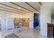 Bright kitchen with wooden cabinets, stainless steel appliances, and a dining area at 2561 S Carey Way, Denver, CO 80222
