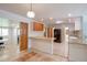 Bright and airy kitchen with center island, modern appliances, and easy access to other rooms at 2561 S Carey Way, Denver, CO 80222