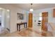 Home office space with bright lighting, sliding wooden doors, and adjacent to the kitchen area at 2561 S Carey Way, Denver, CO 80222