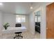 Dedicated home office space with natural light and an adjacent seating area for flexible use at 2561 S Carey Way, Denver, CO 80222