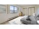 Bright bedroom with large window, closet, and neutral decor at 13902 E Marina Dr # 412, Aurora, CO 80014