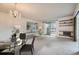 Inviting living room with chandelier, neutral tones, and sliding glass doors to the balcony at 13902 E Marina Dr # 412, Aurora, CO 80014