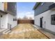Backyard featuring modern landscaping with a stepping stone pathway, providing easy access to the home at 2720 N Saint Paul St, Denver, CO 80205