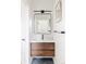 Stylish bathroom featuring a wood vanity, a large mirror, and modern fixtures for a clean, sophisticated look at 2720 N Saint Paul St, Denver, CO 80205