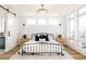 Cozy bedroom showcasing a decorative rug, large window, and a modern light fixture for comfort and style at 2720 N Saint Paul St, Denver, CO 80205