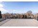 Rooftop deck features wood deck flooring and black railing with skyline views at 2720 N Saint Paul St, Denver, CO 80205