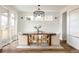 Inviting dining room with modern chandelier, stylish table and chairs, and ample natural light at 2720 N Saint Paul St, Denver, CO 80205