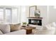 Cozy living room with modern fireplace, comfortable seating, and bright, neutral decor at 2720 N Saint Paul St, Denver, CO 80205