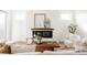 Bright living room featuring a modern fireplace with decorative mantel and minimalist furniture at 2720 N Saint Paul St, Denver, CO 80205