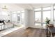 Bright main bedroom with large windows, hardwood floors, and stylish decor for a serene and comfortable retreat at 2720 N Saint Paul St, Denver, CO 80205