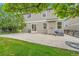 Backyard featuring a well maintained lawn, concrete patio, siding and trees at 11091 Clayton St, Northglenn, CO 80233