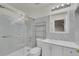 Ensuite bathroom featuring modern fixtures and white marble tiled walls at 11091 Clayton St, Northglenn, CO 80233
